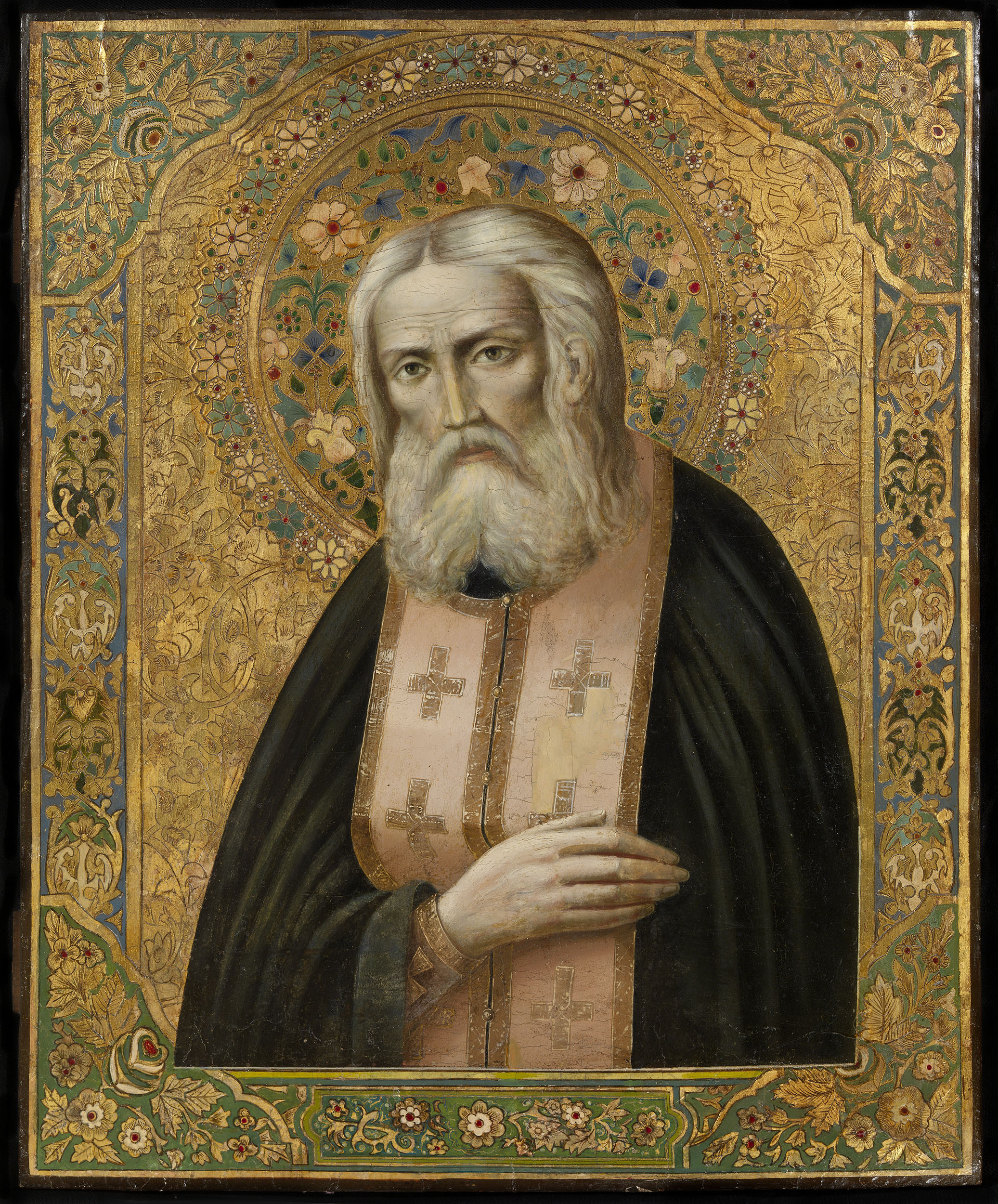 Public-domain icon of Saint Seraphim of Sarov with his right hand resting over his heart